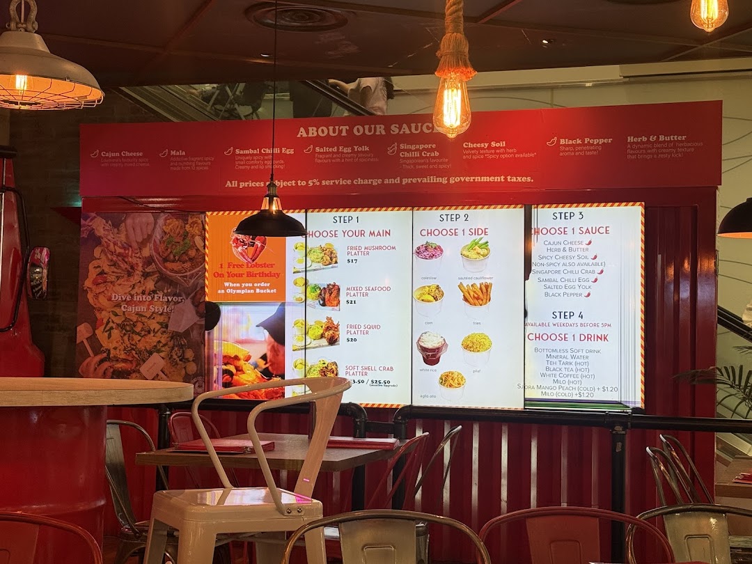 A vibrant menu board showcasing Cajun on Wheels' seafood platters, sauces, and drink options.