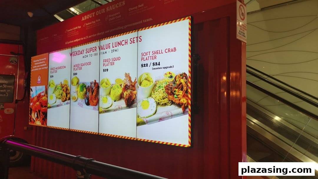 A brightly lit menu board for Cajun on Wheels, showcasing weekday super value lunch sets and sauce options.
