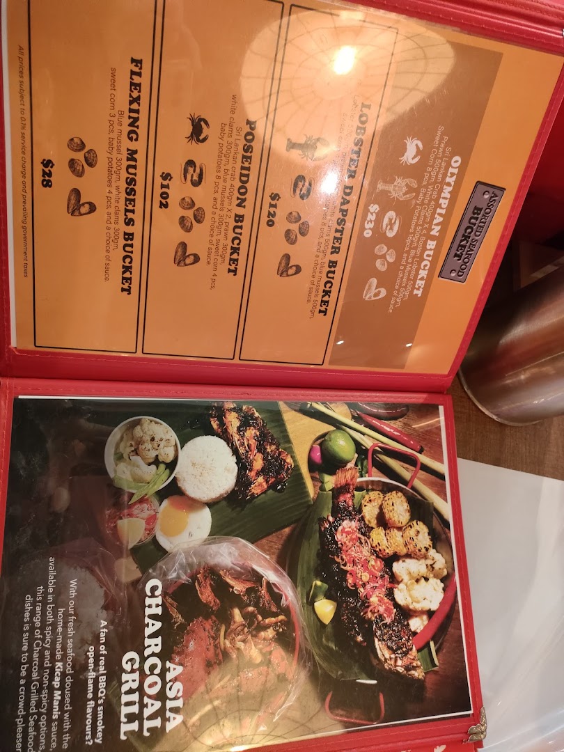 A detailed menu displaying seafood buckets and charcoal grilled dishes with prices.
