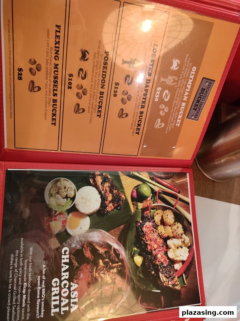 A detailed menu displaying seafood buckets and charcoal grilled dishes with prices.