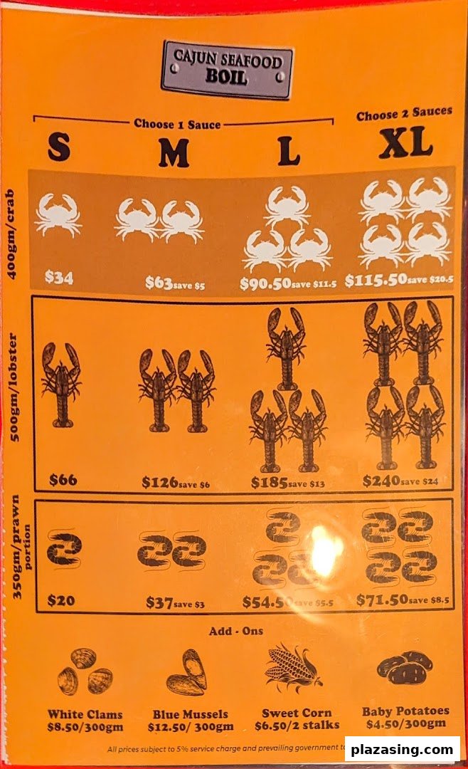 A vibrant orange menu displaying various Cajun seafood boil options and add-ons with prices.
