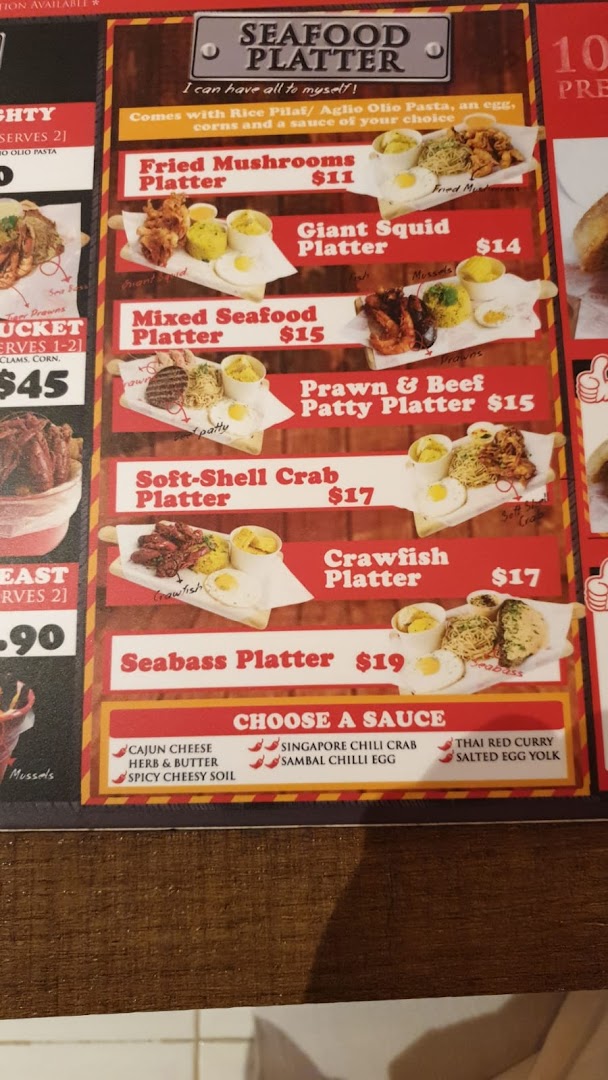 A vibrant menu board showcasing various seafood platters and sauce options.