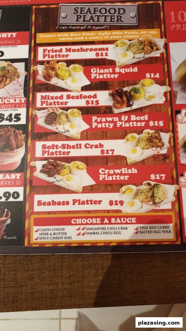 A vibrant menu board showcasing various seafood platters and sauce options.