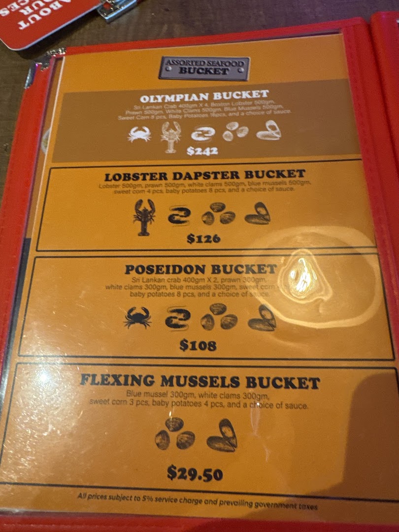 A close-up of Cajun on Wheels' seafood bucket menu, showcasing various options and prices.