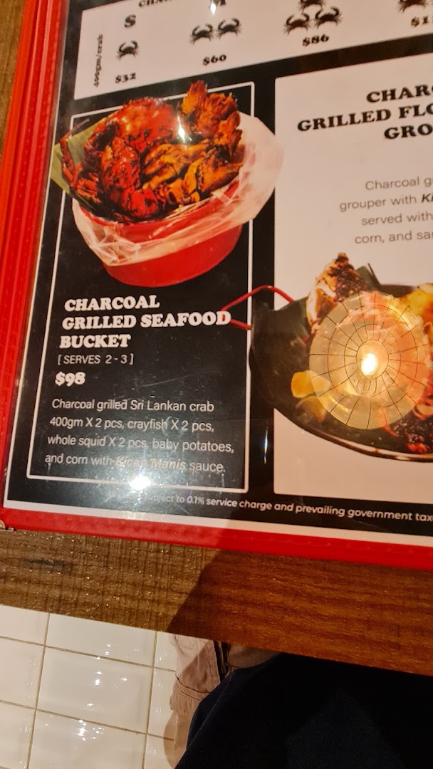 A menu page displaying a charcoal grilled seafood bucket and crab options with prices.