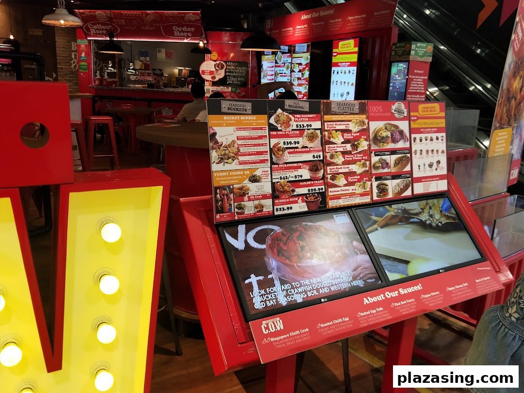 A vibrant menu display at Cajun on Wheels, showcasing seafood buckets, platters, and sauces.