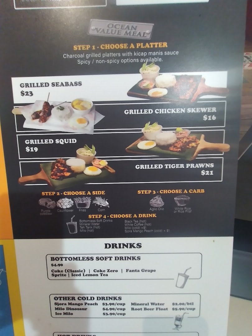 A detailed menu board displaying grilled seafood and chicken platters, sides, carbs, and various drink options.