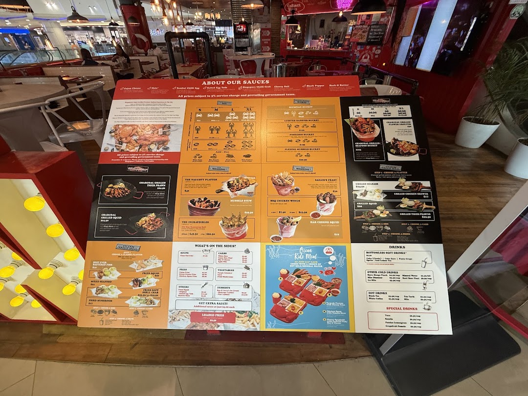 A large, detailed menu board for Cajun on Wheels, showcasing a variety of seafood buckets, grilled items, sides, and drinks.