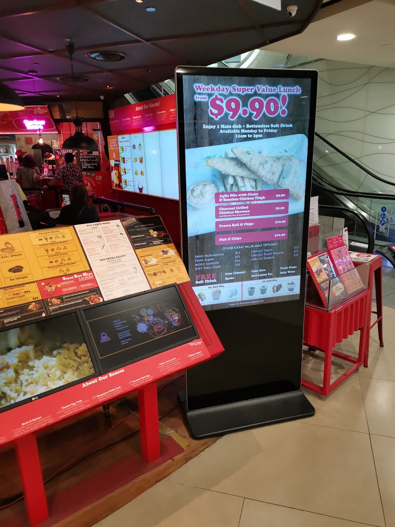 A digital display board showcasing lunch deals and menu items at Cajun on Wheels.