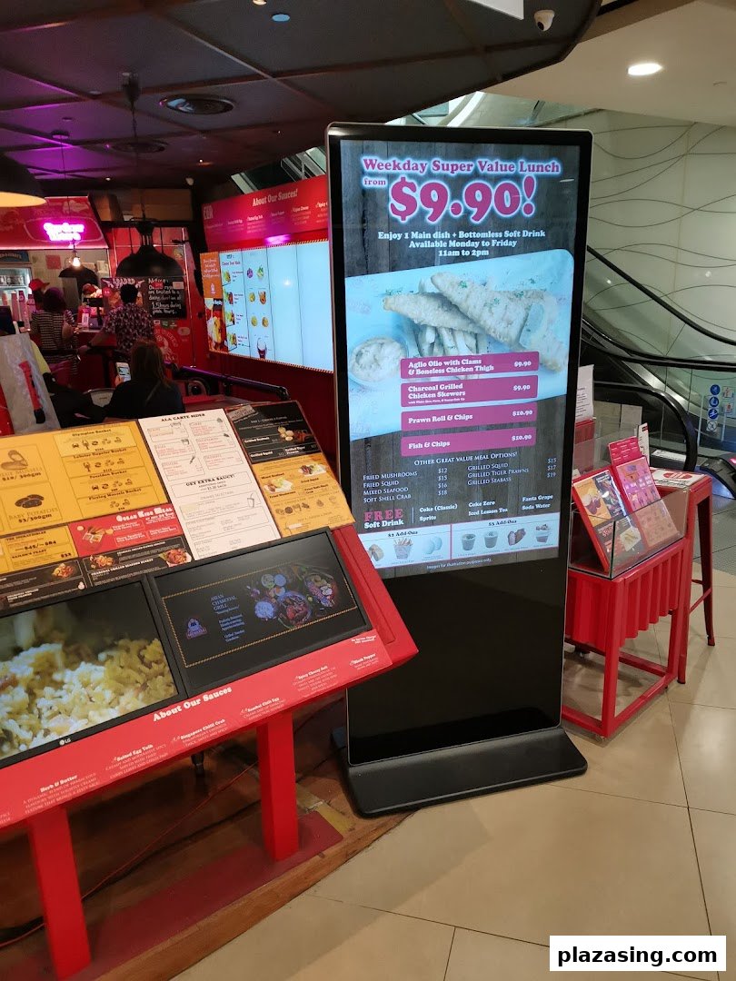 A digital display board showcasing lunch deals and menu items at Cajun on Wheels.