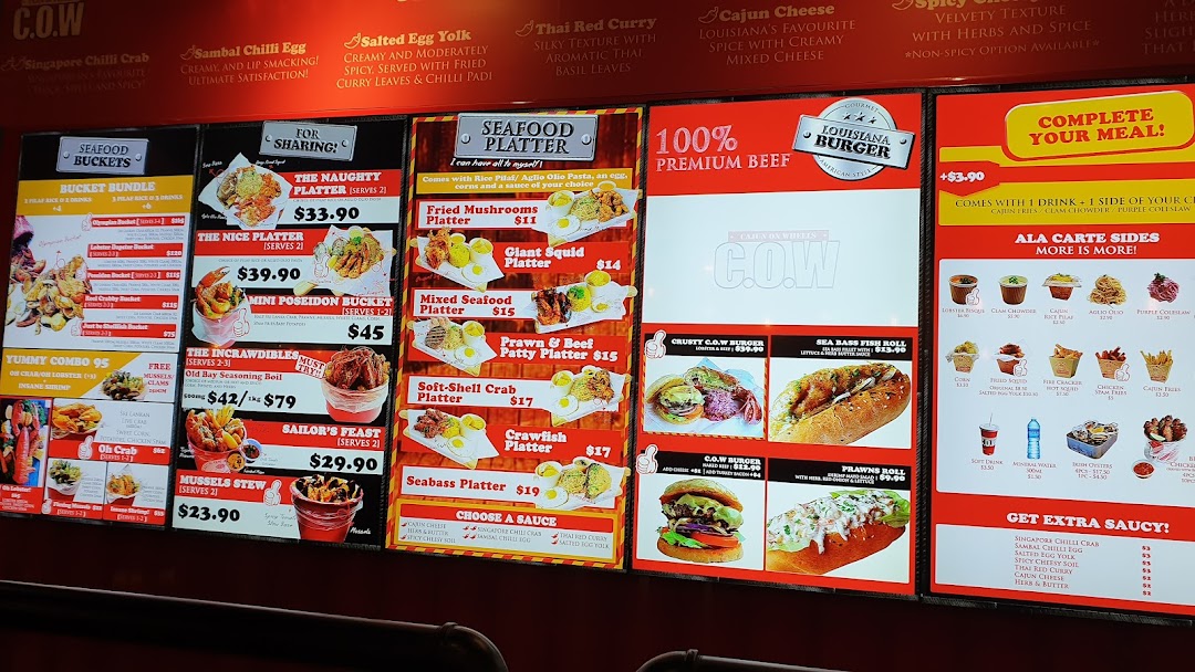 A vibrant digital menu board showcasing a variety of Cajun-inspired seafood platters, buckets, burgers, and sides.