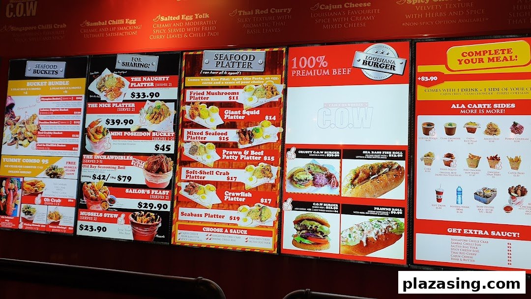 A vibrant digital menu board showcasing a variety of Cajun-inspired seafood platters, buckets, burgers, and sides.