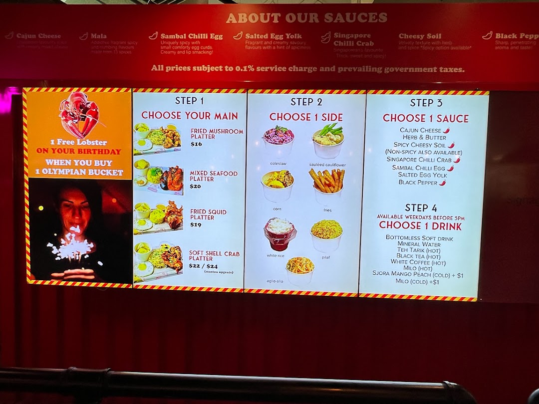 A digital menu board displaying customizable Cajun seafood platters, sides, sauces, and drinks.