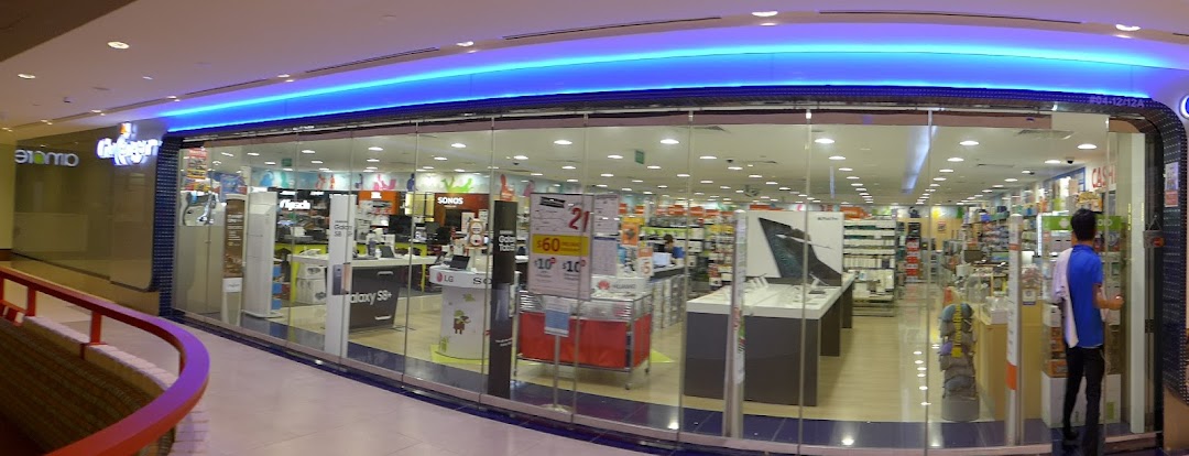 Brightly lit entrance of Challenger, an electronics store, showcasing various tech products and displays.