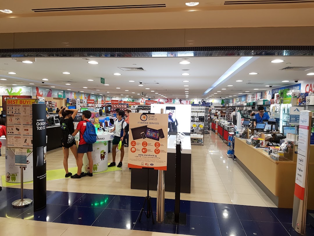 Interior view of Challenger, an electronics store, with customers browsing various tech products and displays.