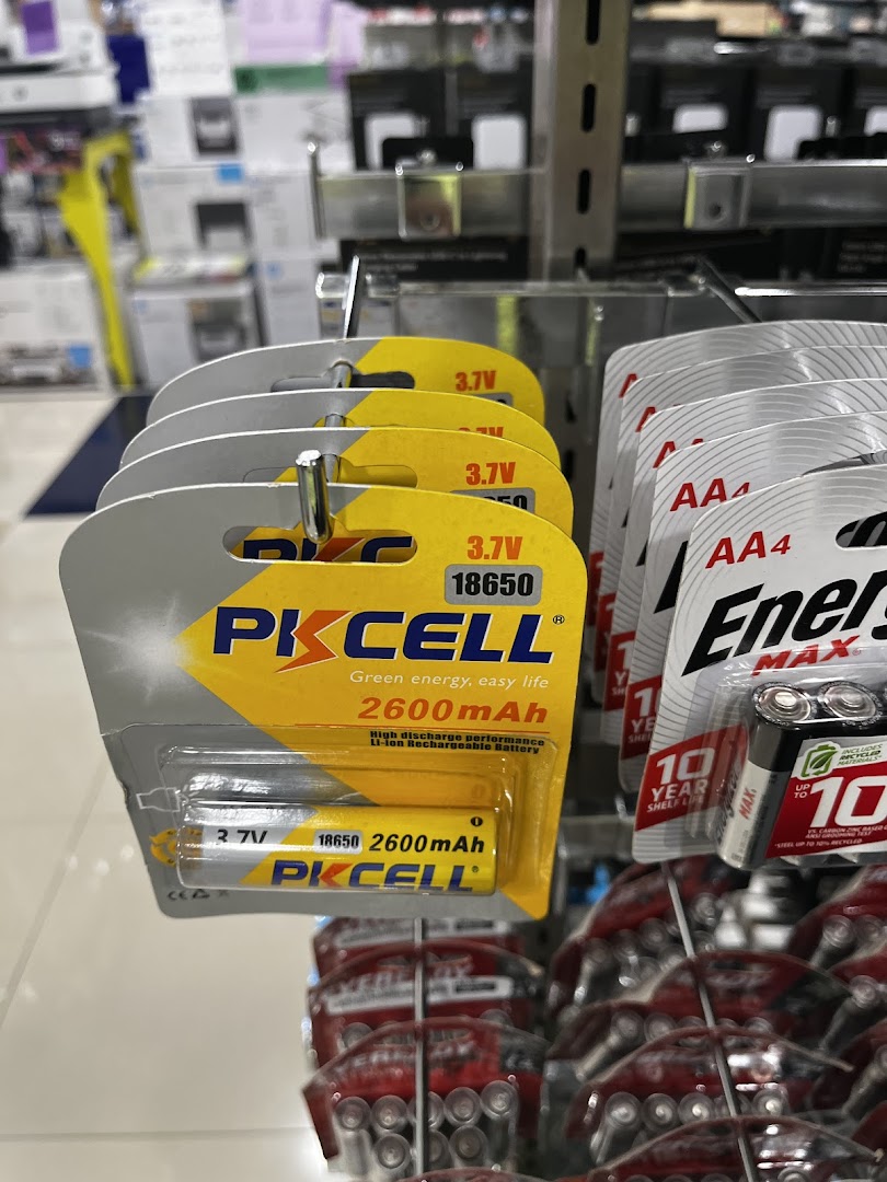 Close-up of PKCELL 18650 rechargeable batteries and Energizer AA batteries displayed on a retail shelf at Challenger.