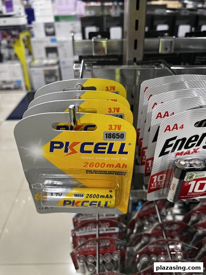 Close-up of PKCELL 18650 rechargeable batteries and Energizer AA batteries displayed on a retail shelf at Challenger.