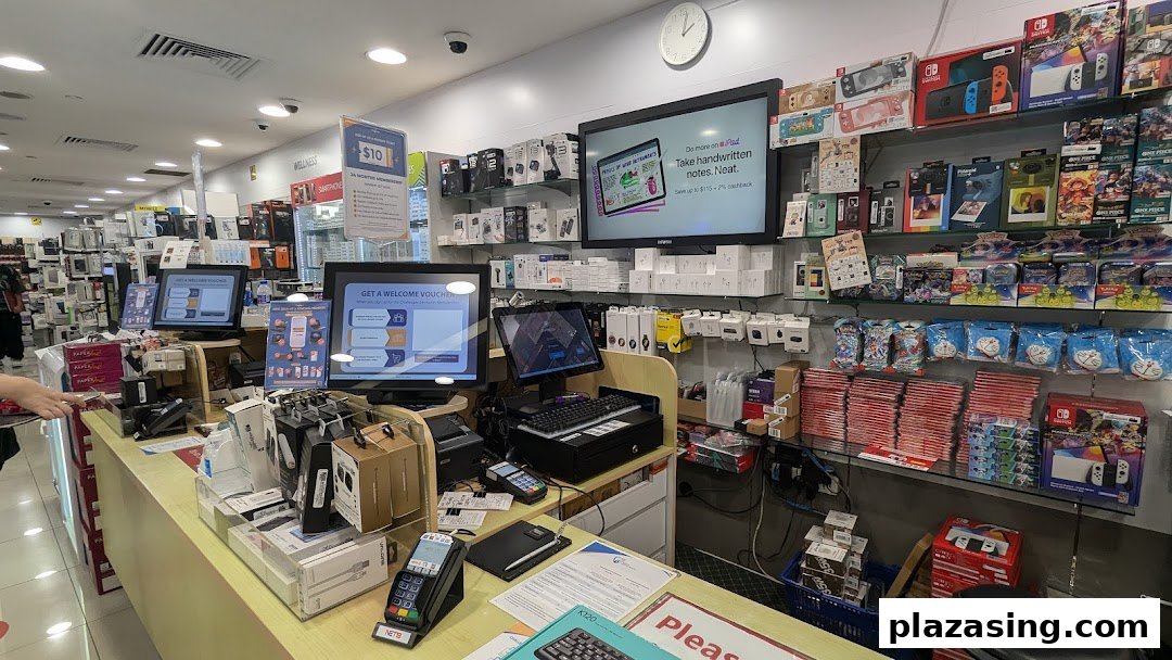 Interior view of an electronics store showcasing various gadgets, accessories, and gaming consoles.