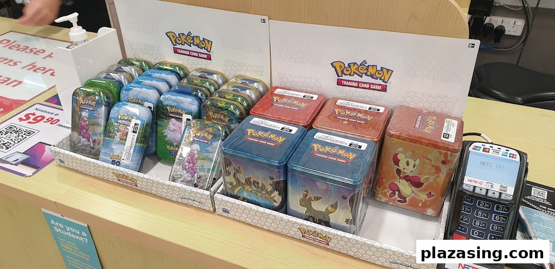 A vibrant display of various Pokémon Trading Card Game tins and boxes at Challenger Plaza Singapura.