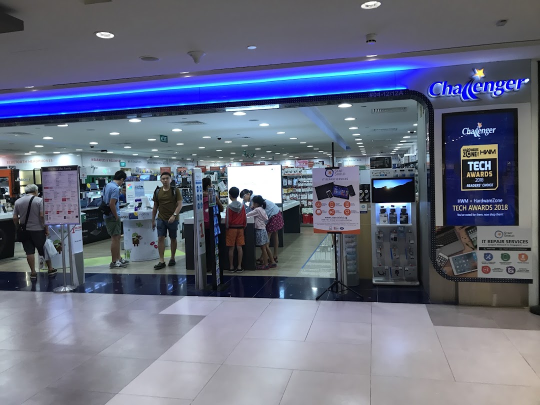 Entrance of Challenger electronics store with customers browsing and promotional displays.