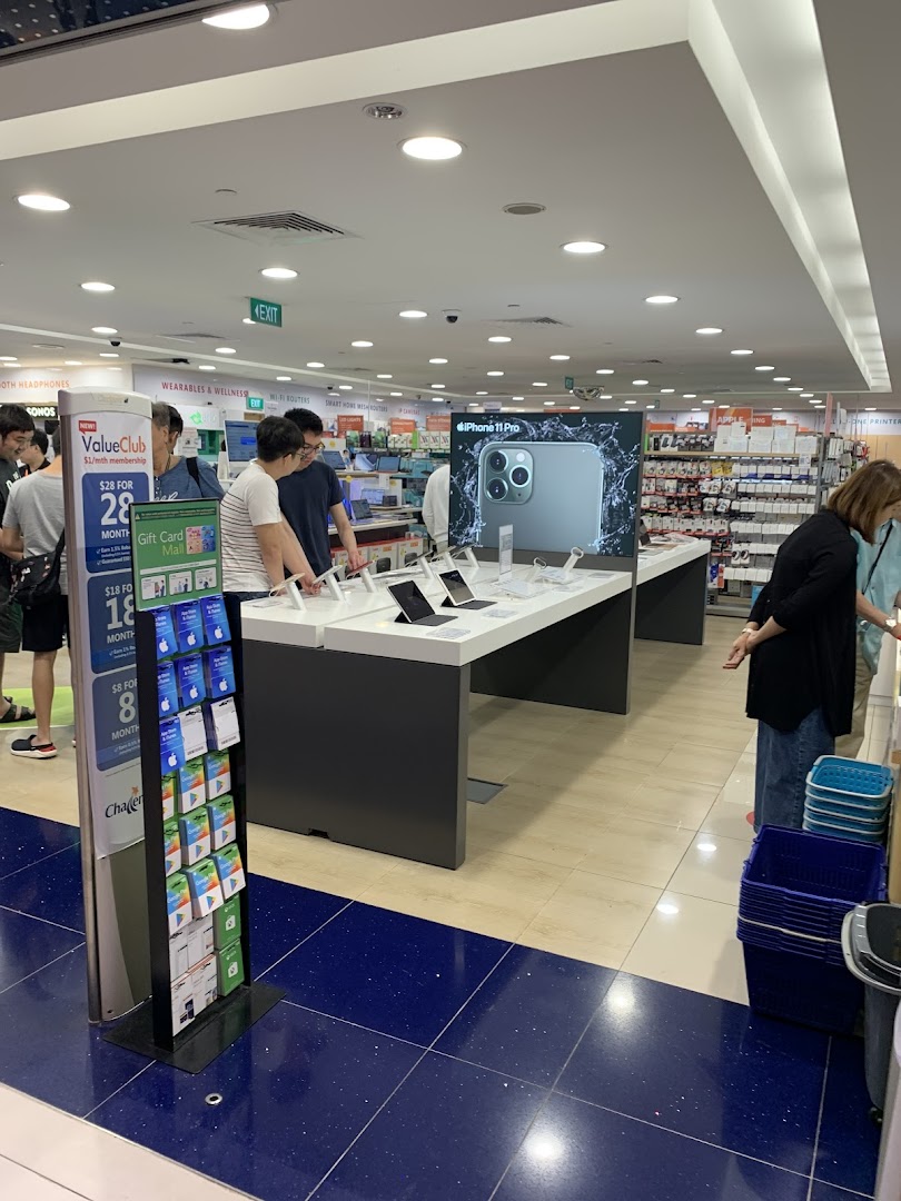 Customers browse electronics, including an iPhone 11 Pro display, at Challenger Plaza Singapura.