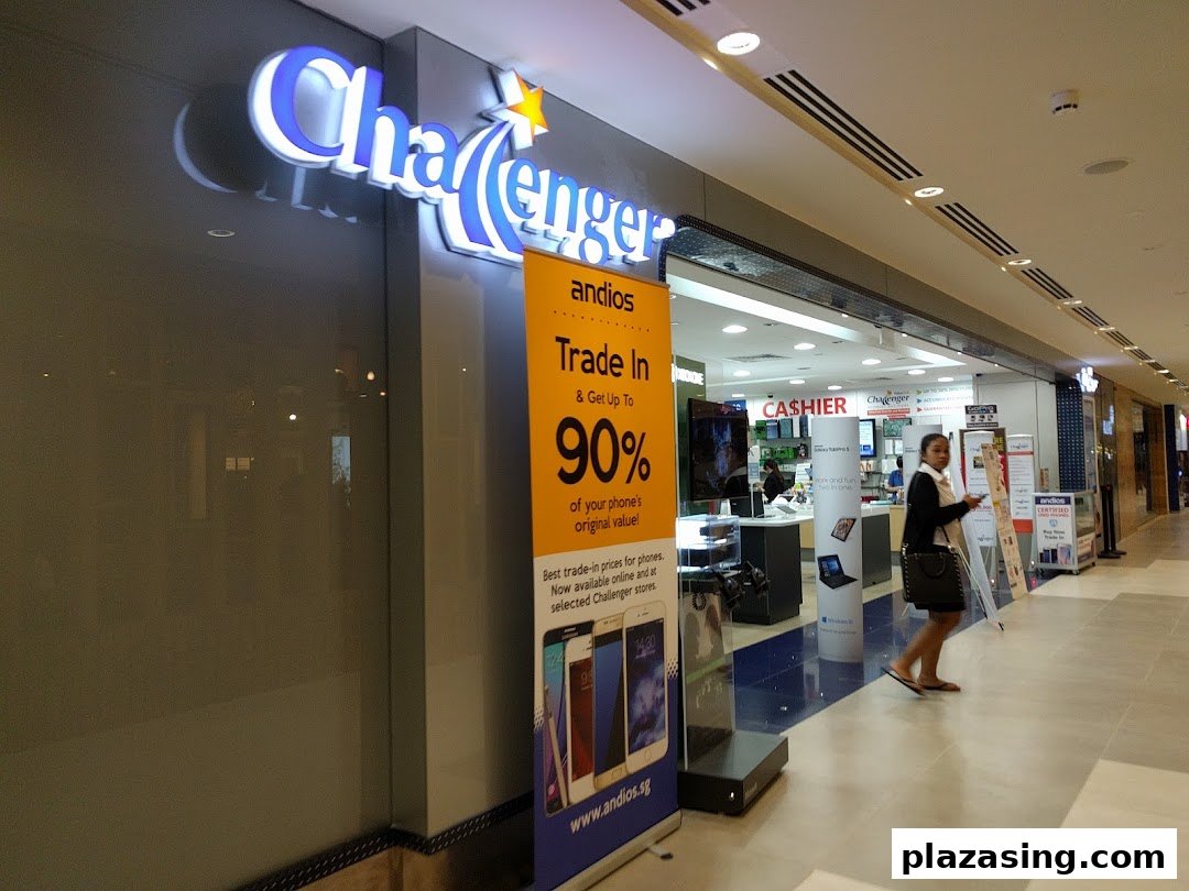 The shop front of Challenger Plaza Singapura, featuring its illuminated logo and a trade-in promotion banner.