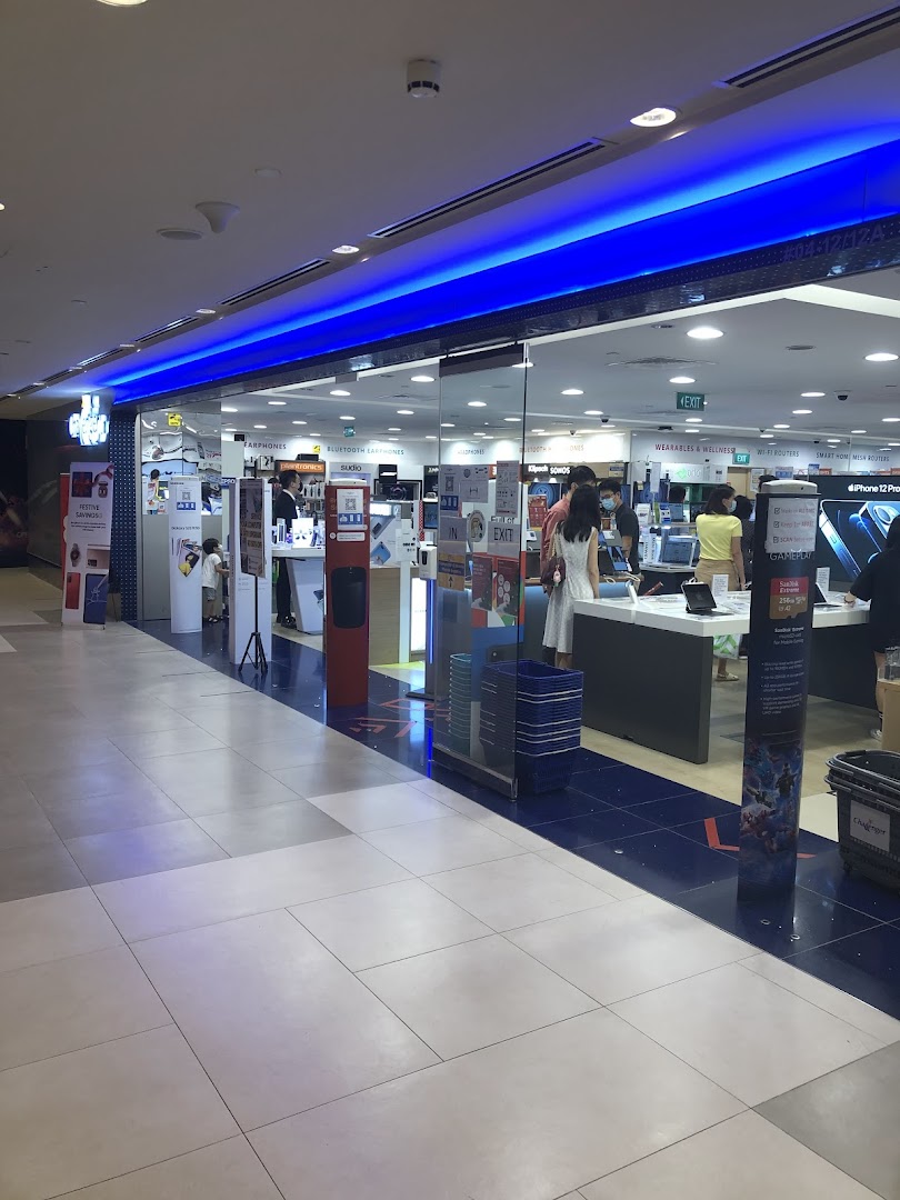 The shop front of Challenger Plaza Singapura, an electronics store, with customers browsing inside.