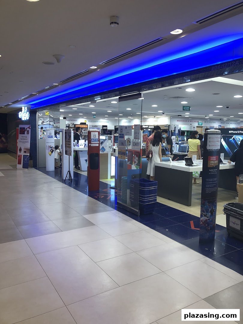 The shop front of Challenger Plaza Singapura, an electronics store, with customers browsing inside.