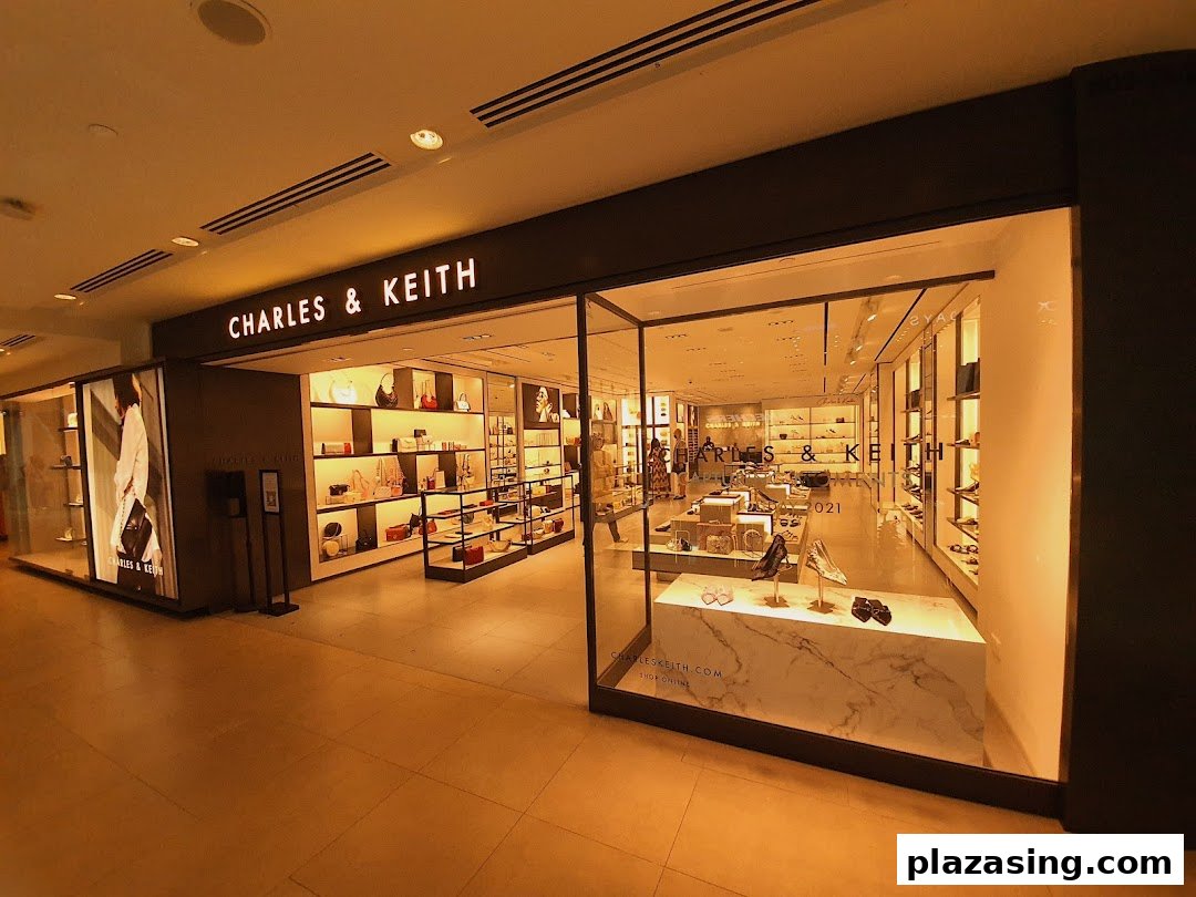 The brightly lit storefront of CHARLES & KEITH showcases a wide array of stylish bags and shoes.