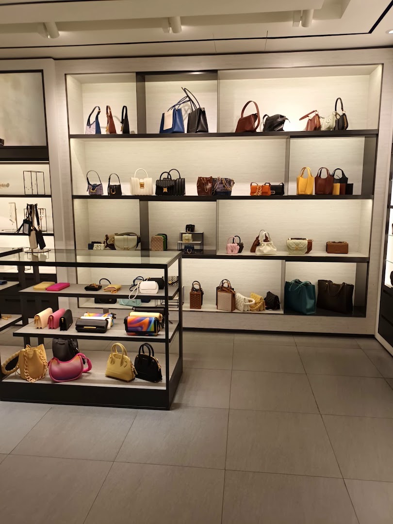 An interior view of CHARLES & KEITH showcasing a wide array of stylish handbags and accessories on display shelves.
