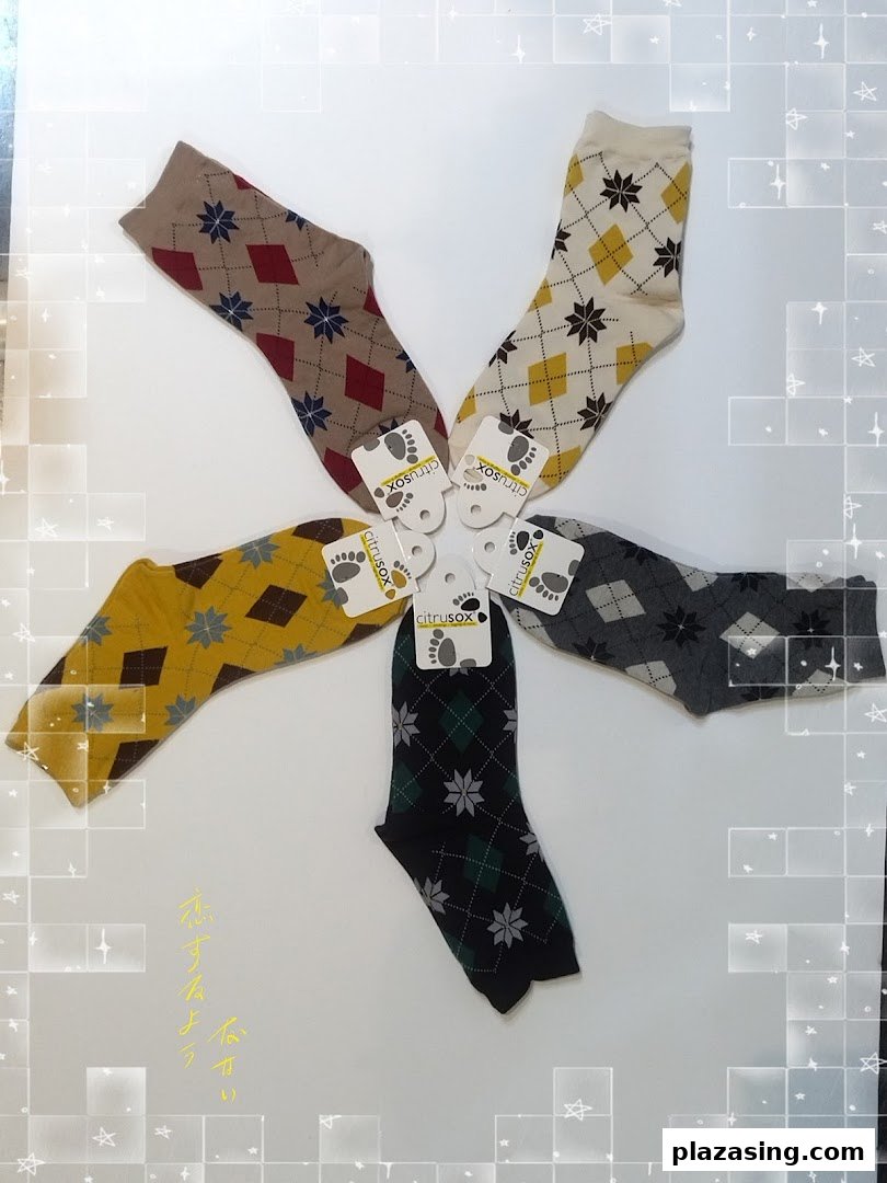 An array of colorful argyle-patterned socks from Citrusox, arranged in a circular display.