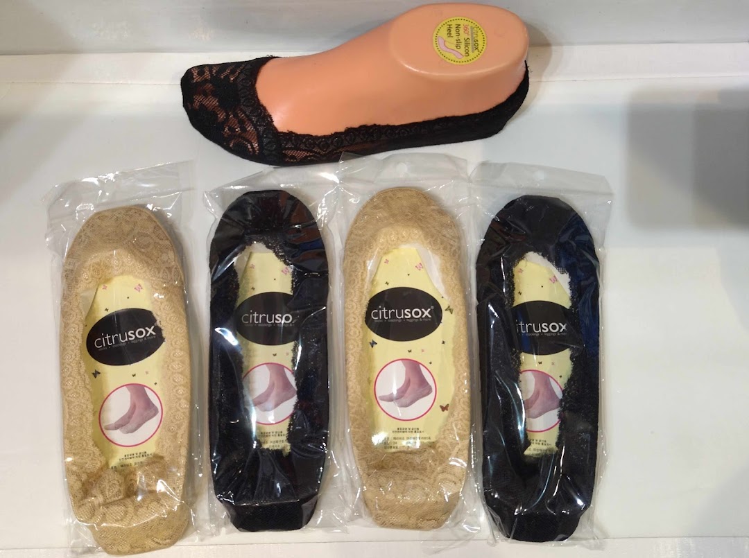 Citrusox lace no-show socks in various colors displayed with a mannequin foot.
