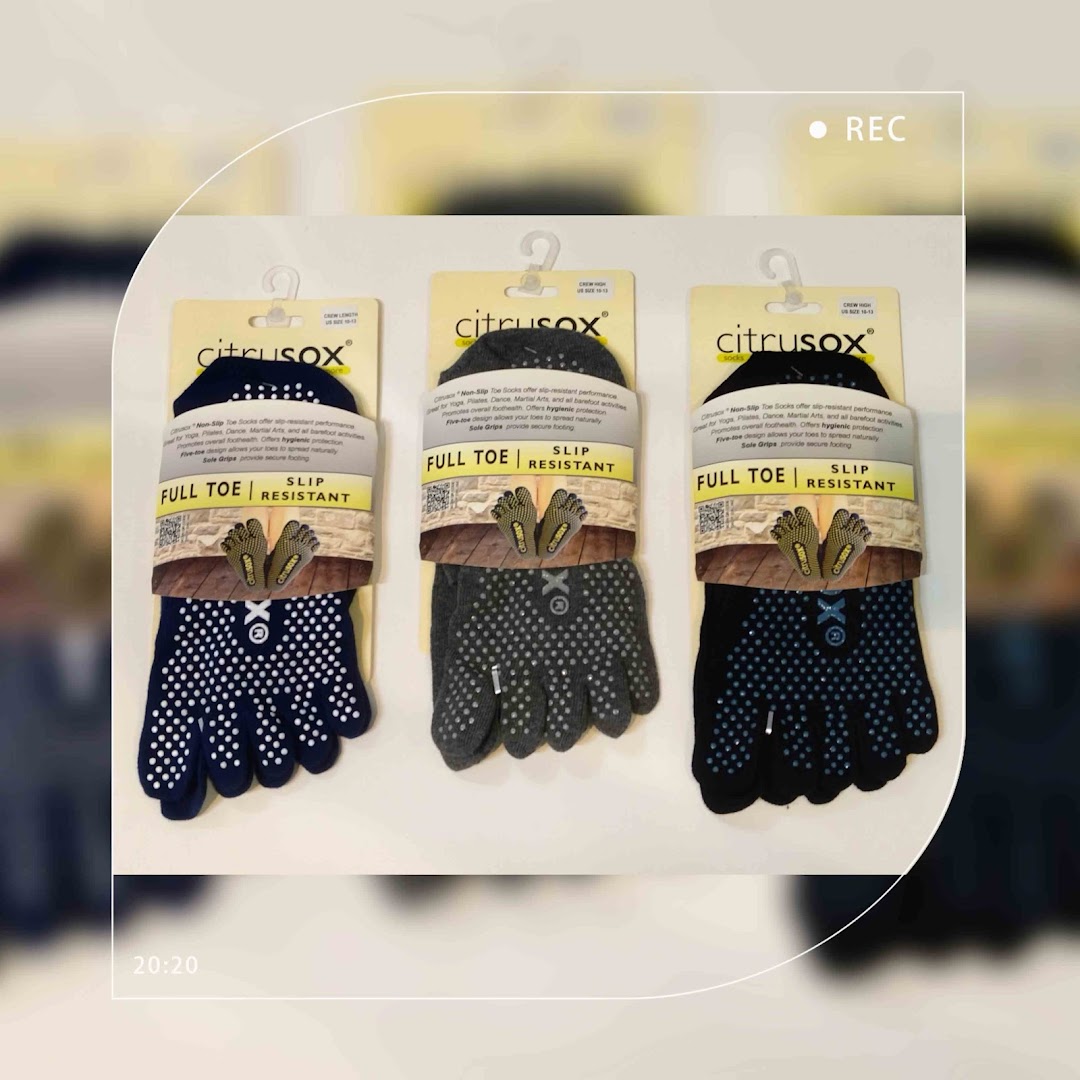 Three pairs of Citrusox non-slip full toe socks displayed on their packaging.