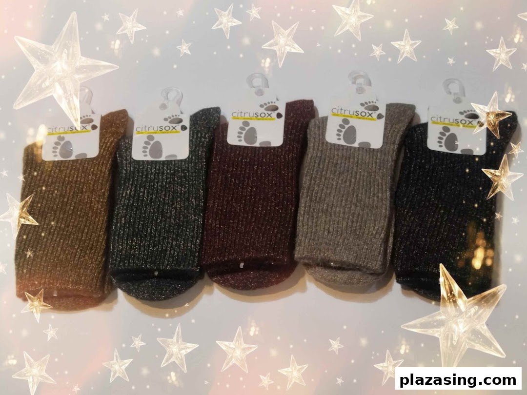 A row of five Citrusox socks in various shimmering colors, displayed with star overlays.