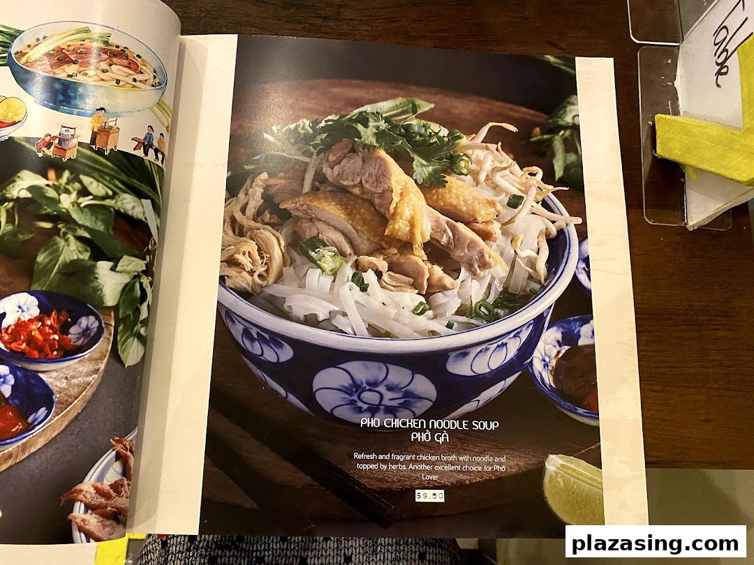 A menu page displaying a vibrant image of Pho Chicken Noodle Soup with its description and price.