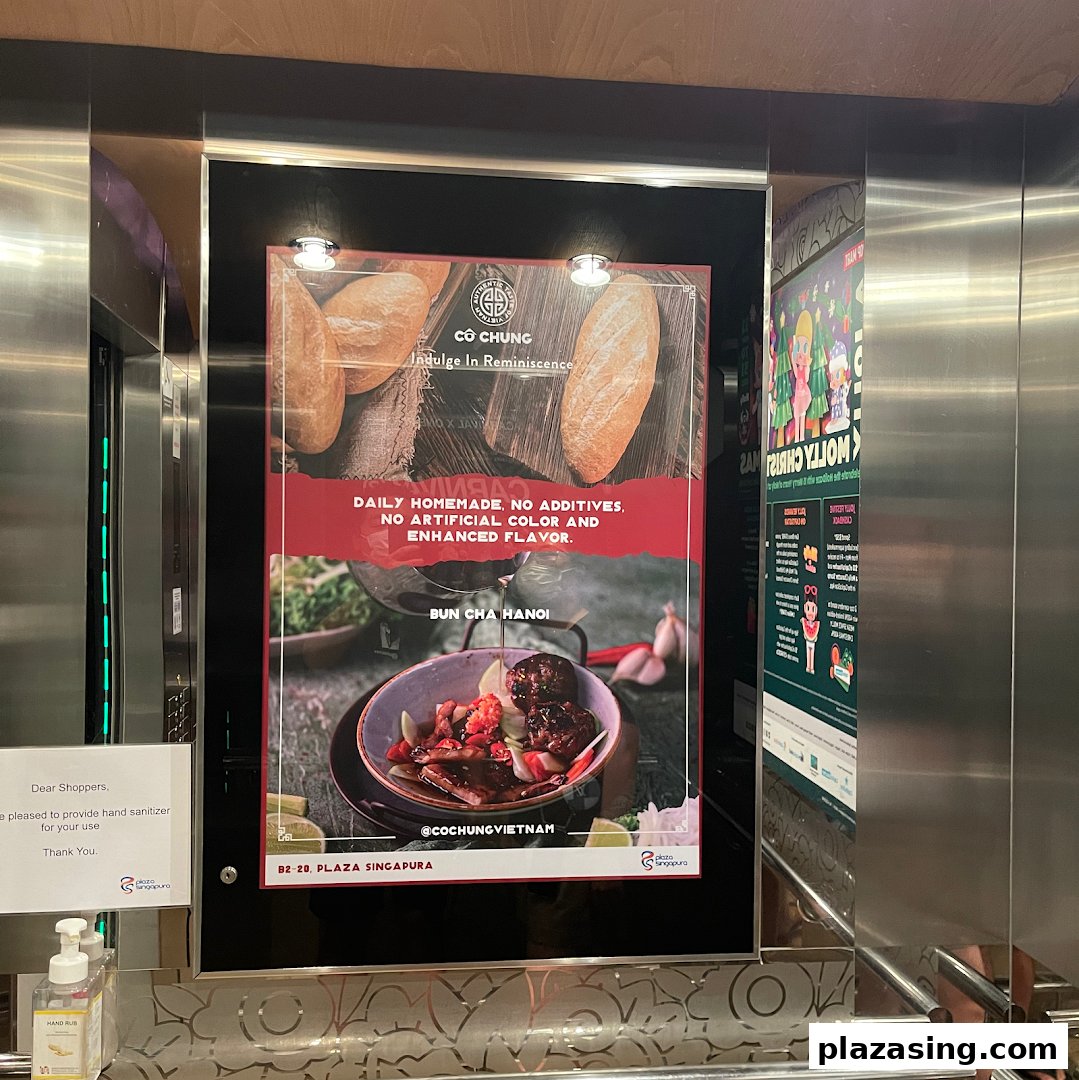 An advertisement for Co Chung Vietnamese Restaurant featuring Bun Cha Hanoi and baguettes, highlighting homemade quality.