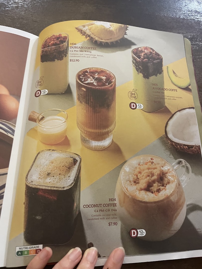 A vibrant menu page showcasing unique Vietnamese coffee drinks like Durian, Avocado, and Coconut Coffee.