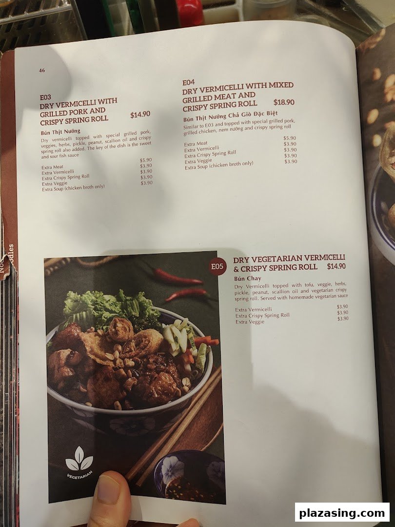 A page from Co Chung's menu showcasing various dry vermicelli dishes with detailed descriptions and prices.