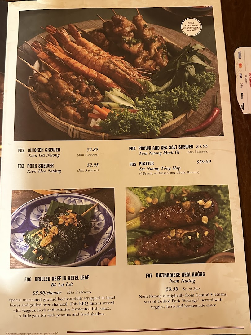 A vibrant menu showcasing Vietnamese grilled skewers, platters, and specialty dishes with descriptions and prices.