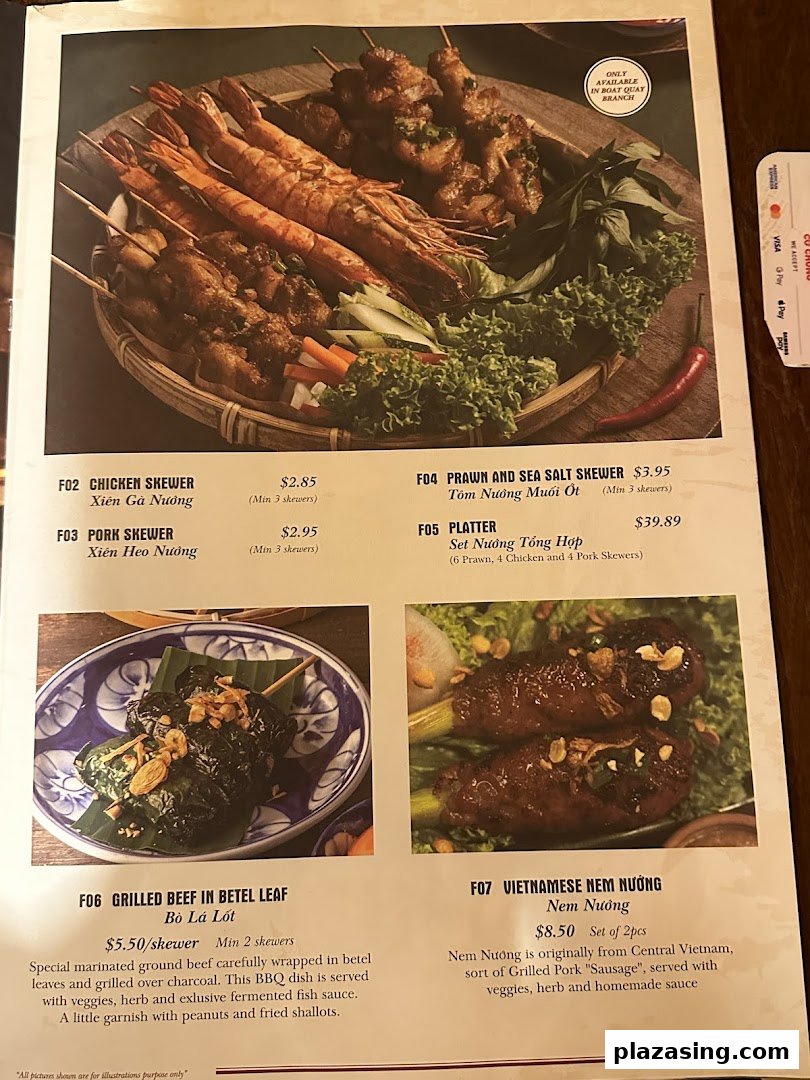 A vibrant menu showcasing Vietnamese grilled skewers, platters, and specialty dishes with descriptions and prices.