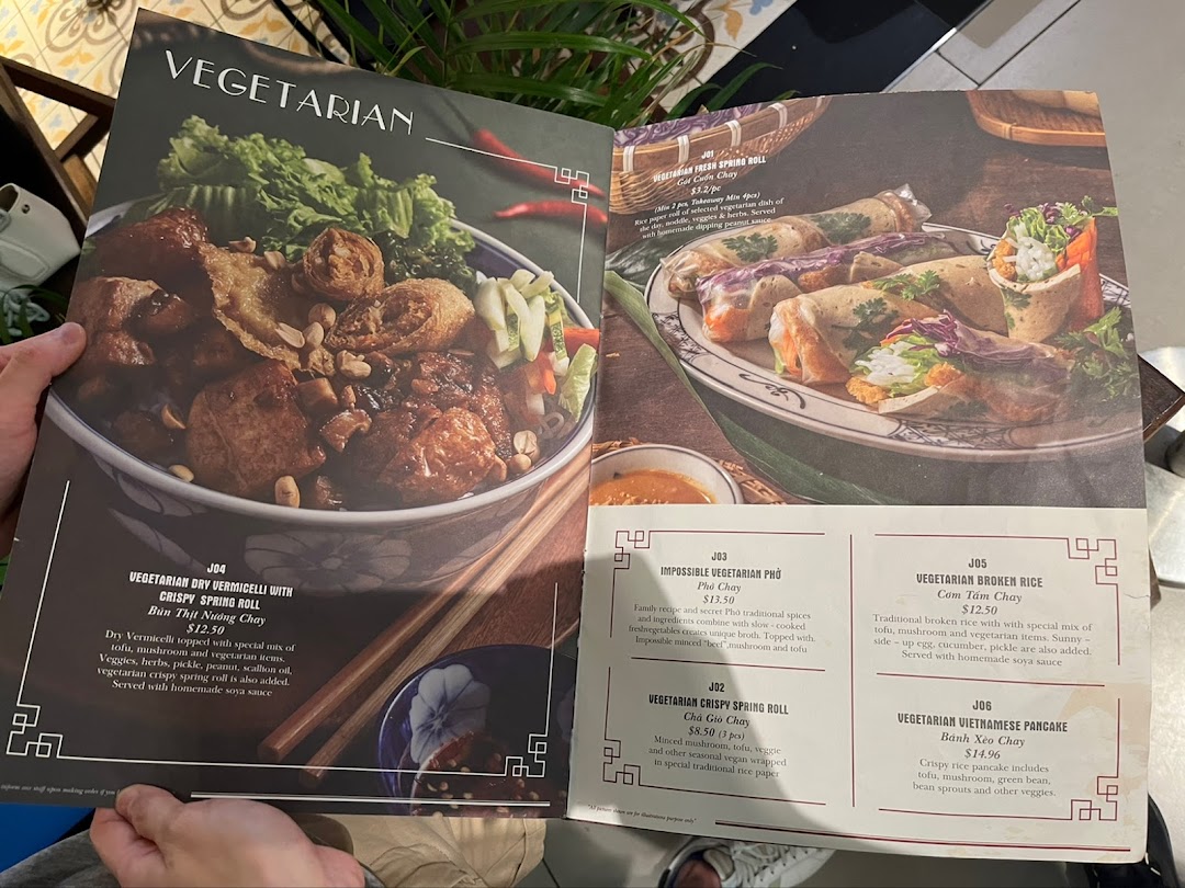 A close-up view of Co Chung Vietnamese Restaurant's vegetarian menu, showcasing various dishes.