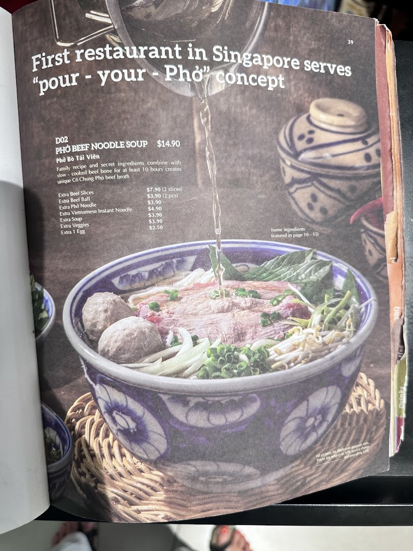 A menu page featuring a 'pour-your-pho' concept with a bowl of beef noodle soup and add-on options.