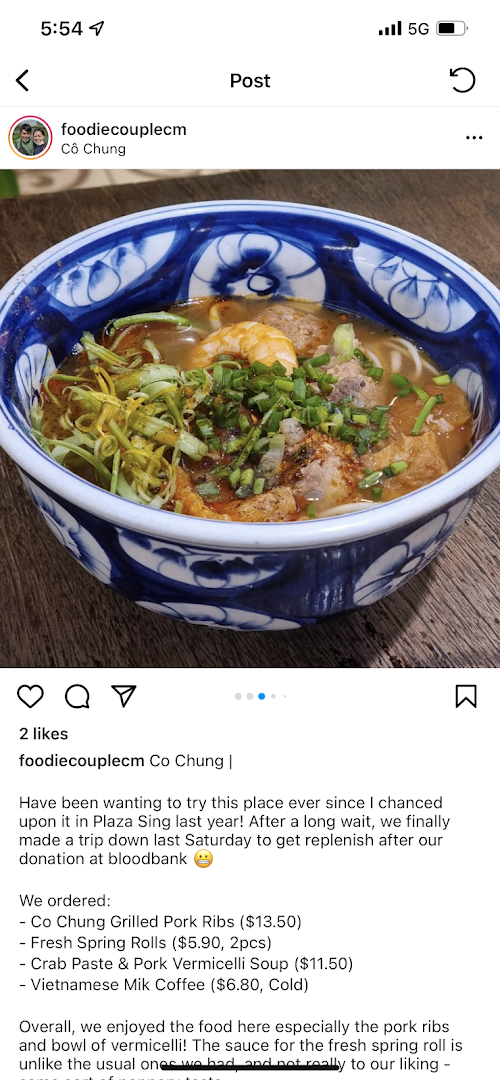 A vibrant bowl of Vietnamese vermicelli soup with shrimp, pork, and fresh herbs.