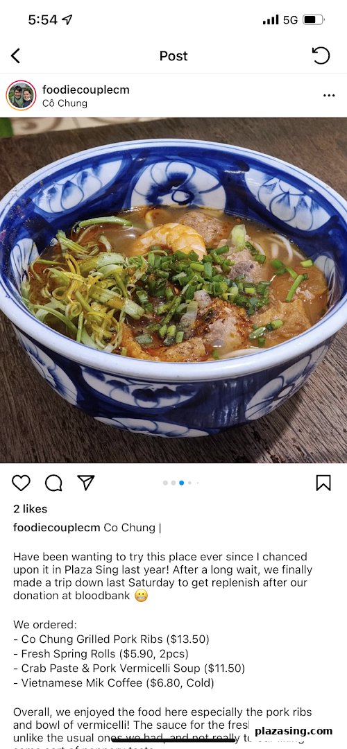 A vibrant bowl of Vietnamese vermicelli soup with shrimp, pork, and fresh herbs.