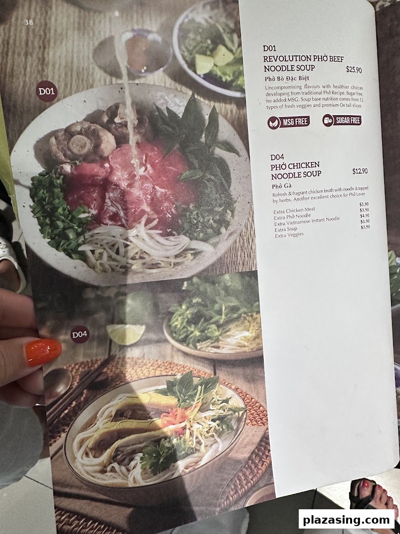 A menu page from Co Chung Vietnamese Restaurant featuring Revolution Pho Beef and Pho Chicken Noodle Soup.