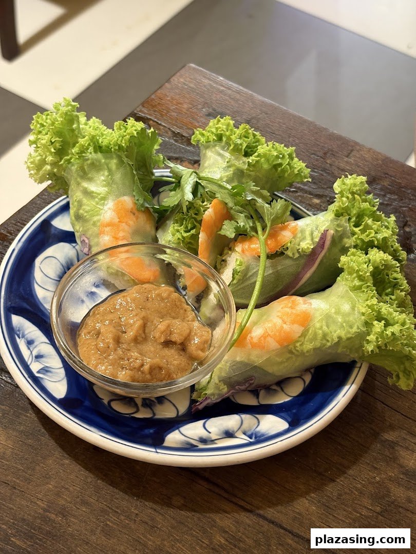 Fresh Vietnamese spring rolls with shrimp and lettuce, served with a rich peanut dipping sauce.