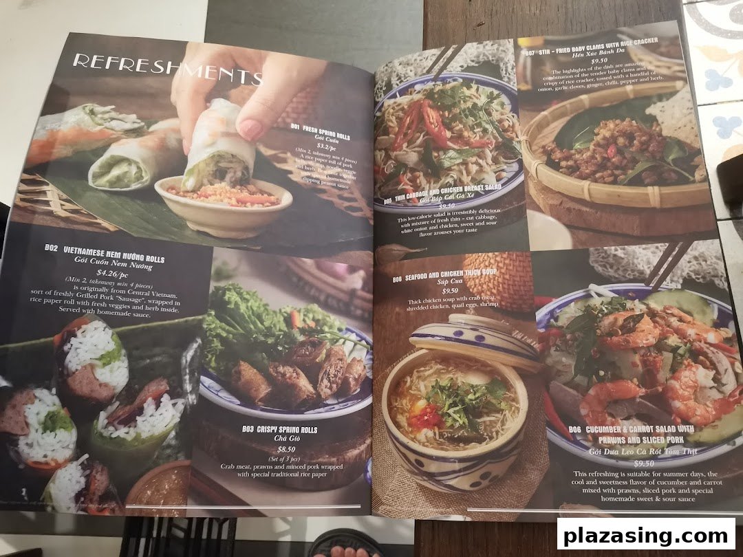 A Vietnamese restaurant menu showcasing appetizers, salads, and soups with descriptions and prices.