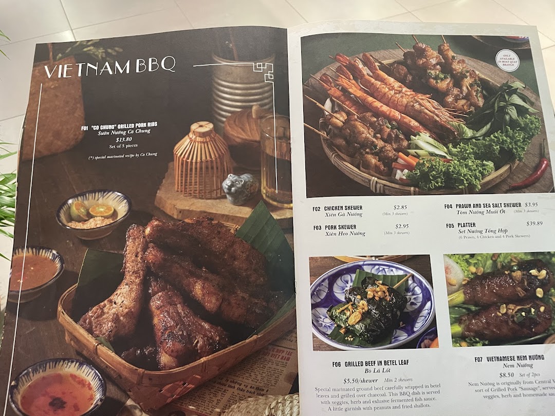 A vibrant menu page showcasing authentic Vietnamese BBQ dishes with detailed descriptions and prices.