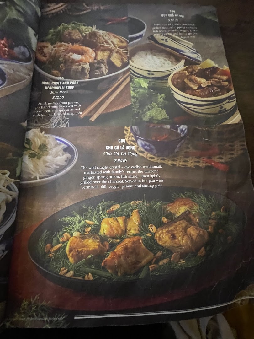 A menu page displaying authentic Vietnamese dishes with their descriptions and prices.