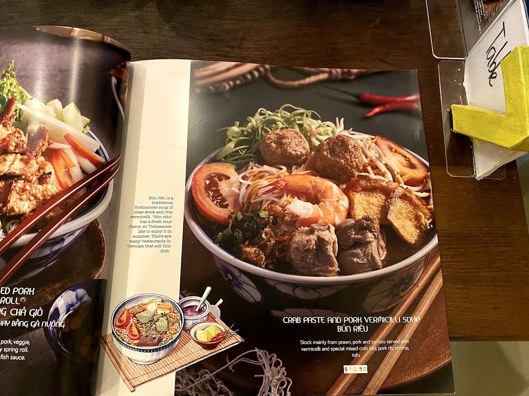A menu page from Co Chung Vietnamese Restaurant showcasing their Crab Paste and Pork Vermicelli Soup (Bún Riêu).